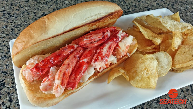 A photograph of a butter poached Chilean king crab roll.
