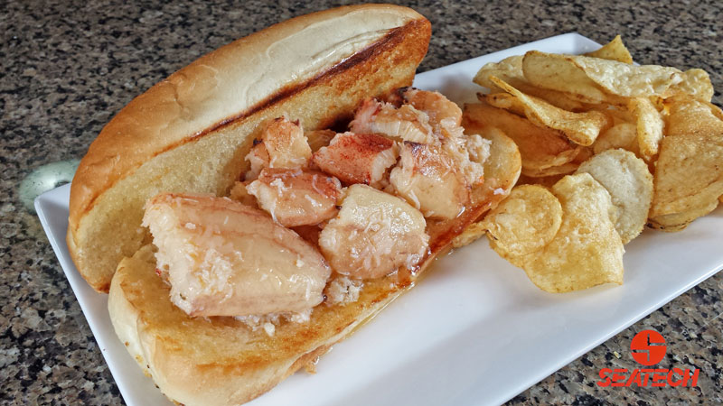 A photograph of a butter poached Chilean crab meat roll.