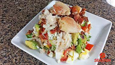 A photograph of a crab COBB salad featuring Seatech Chilean crab meat.