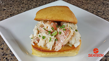 A photograph of a crab slider featuring Seatech's Chilean crab meat.