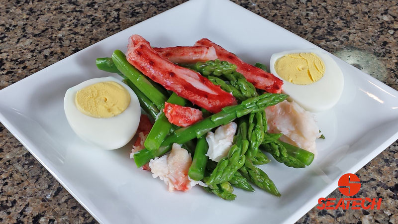 A photograph of a Chilean king crab asparagus salad.