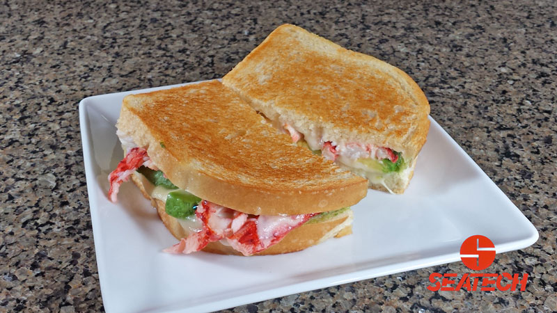 A photograph of a Chilean king crab meat and avocado grilled cheese.