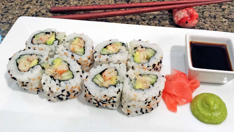 A photograph of California rolls with real crab meat. No surimi here. Who wants fake crab when you can have the real thing.