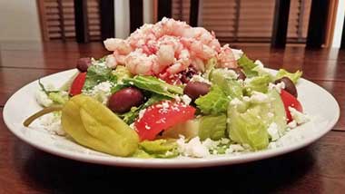 Seatech Chilean shrimp, lettuce, kalmata ollives, tomatoes, feta, salad dressing, cucumbers. www.seatechcorp.com