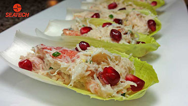 Endive leaves filled wtih crab salad and pomegranate arils.