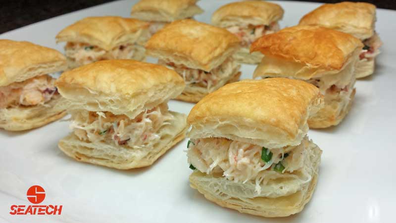 Bite sized puff pastry fill with crab salad.